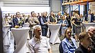 Gäste während eines Vortrags auf der Jubiläumsfeier von enatek in Hadamar